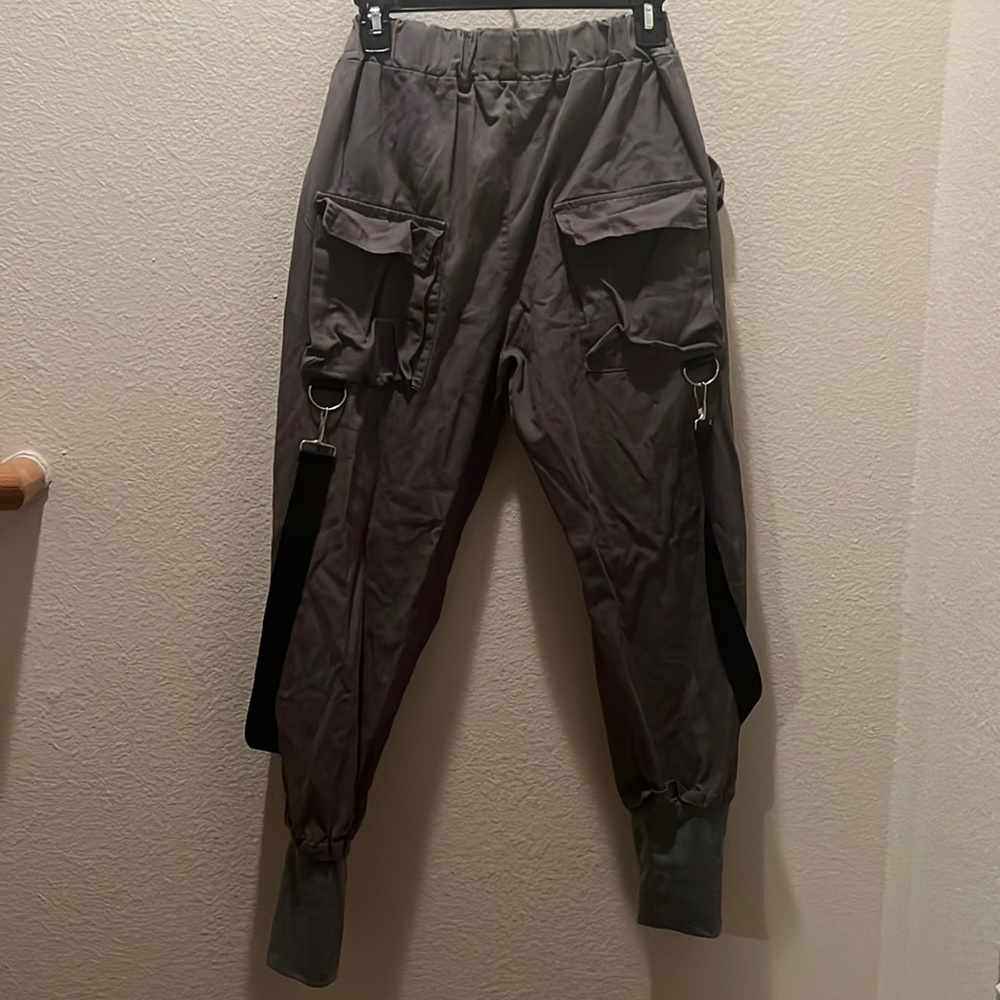 Dark gray jogger pants with straps
